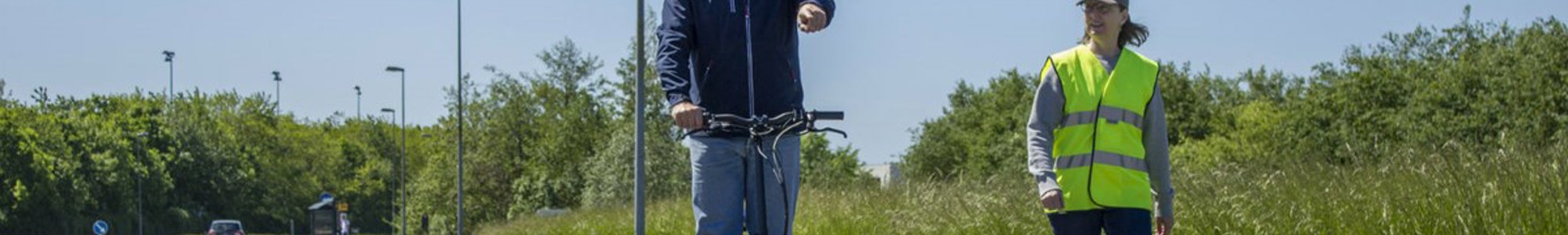 Brian Henriksen On Scooter On Bike Path